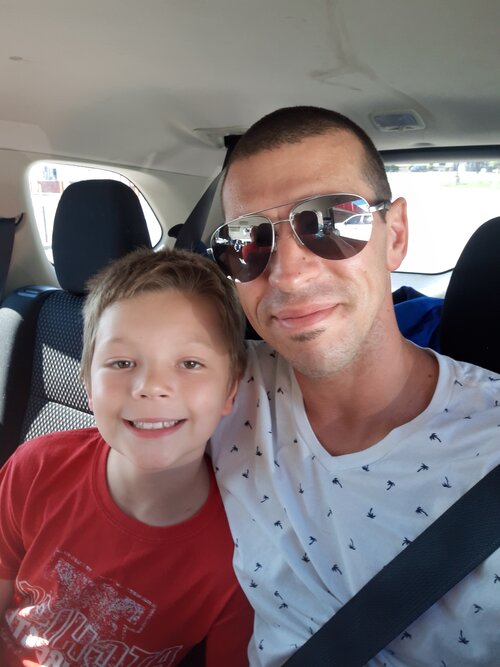 jeremy with son in the car with sunglasses on