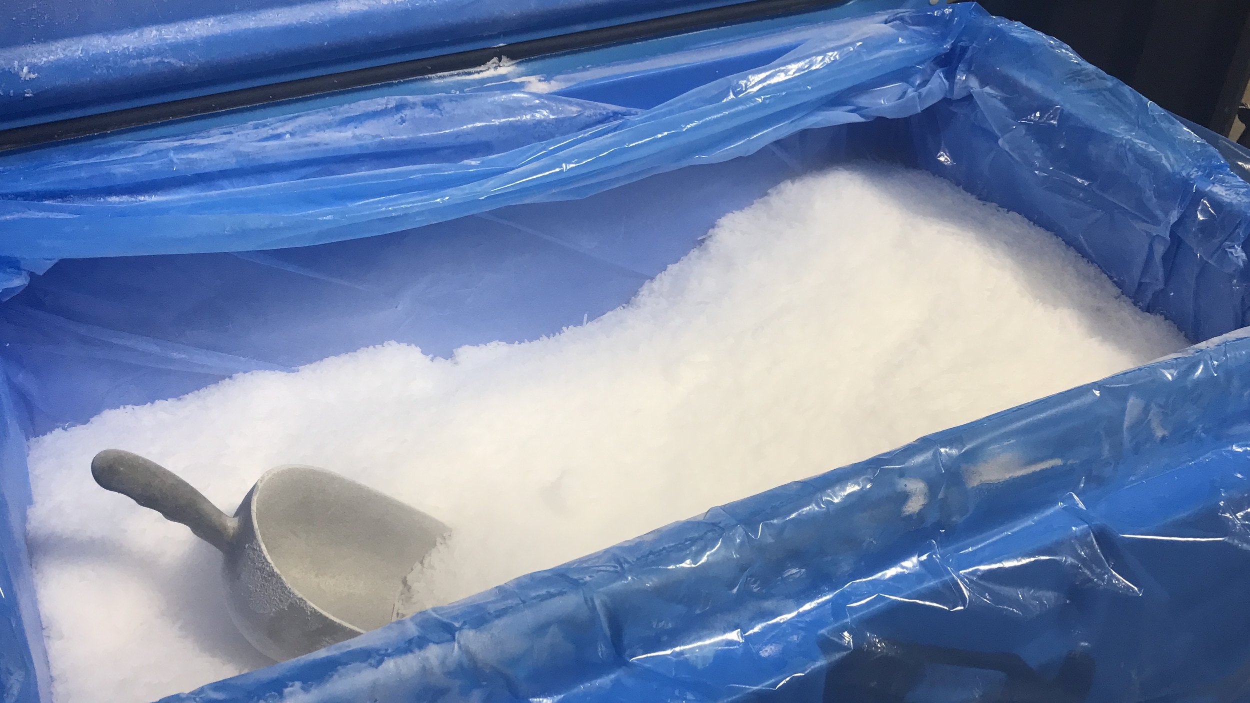 dry ice pellets in container with scoop