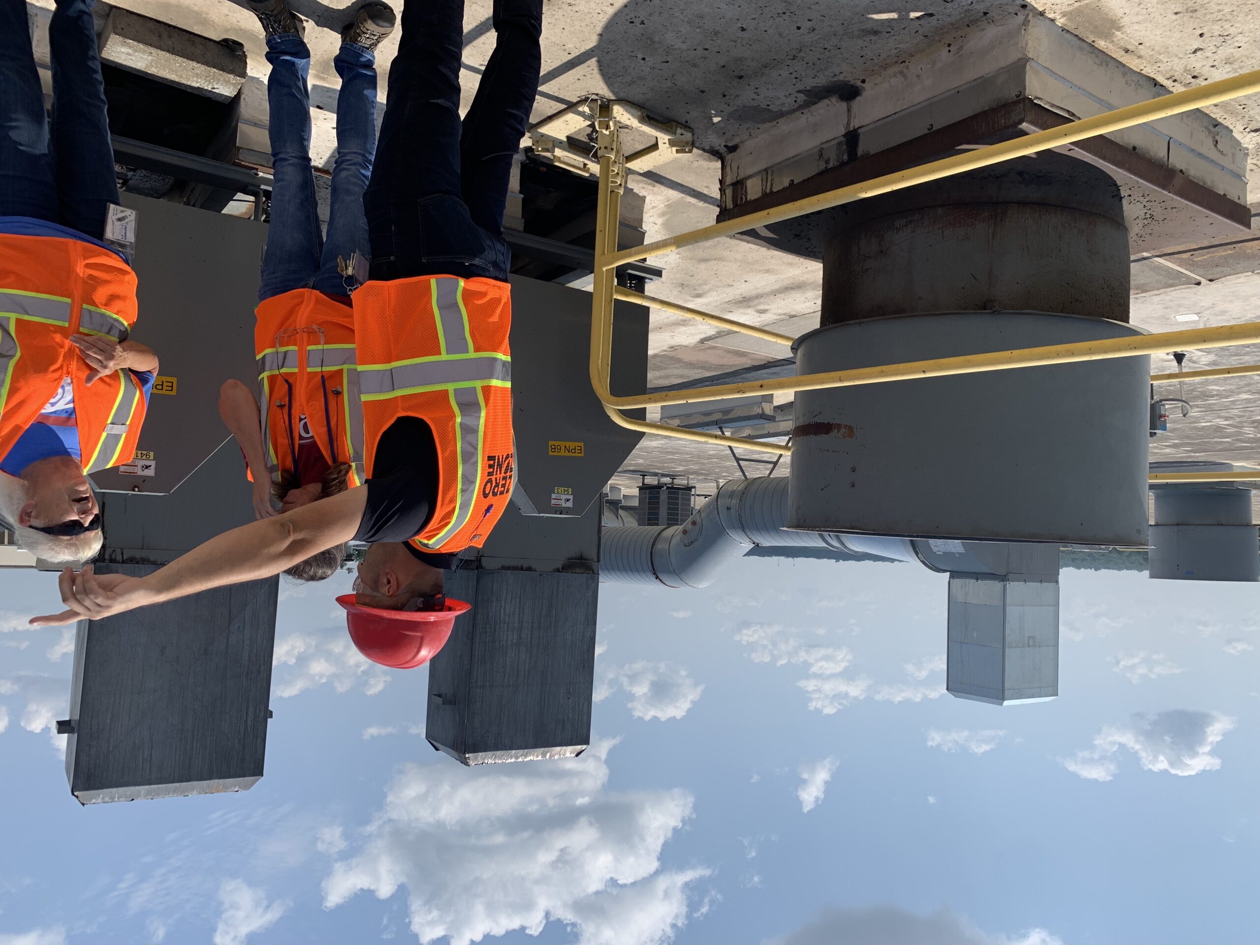 construction workers in safety gear having a discussion