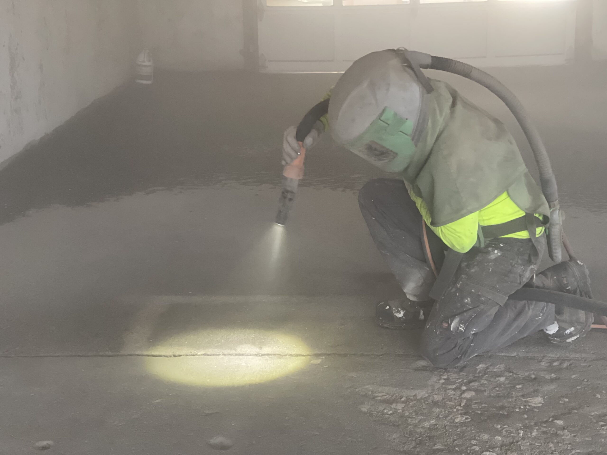 crew member applying tank lining crew member applying tank lining