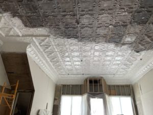 during tin ceiling restoration process