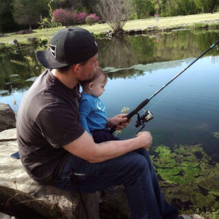 zack with daughter fishing