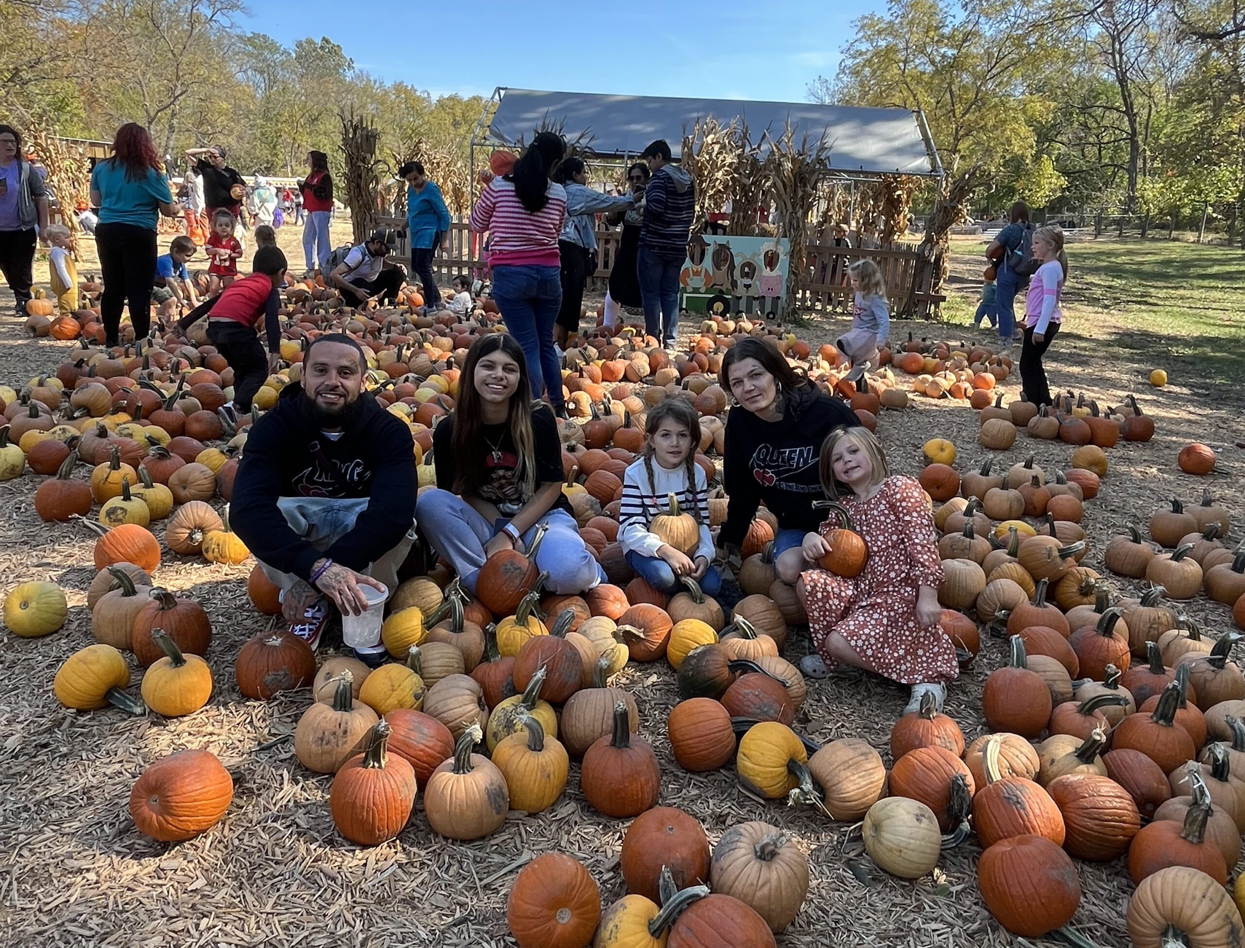 tony and his family at a pumpkin patch