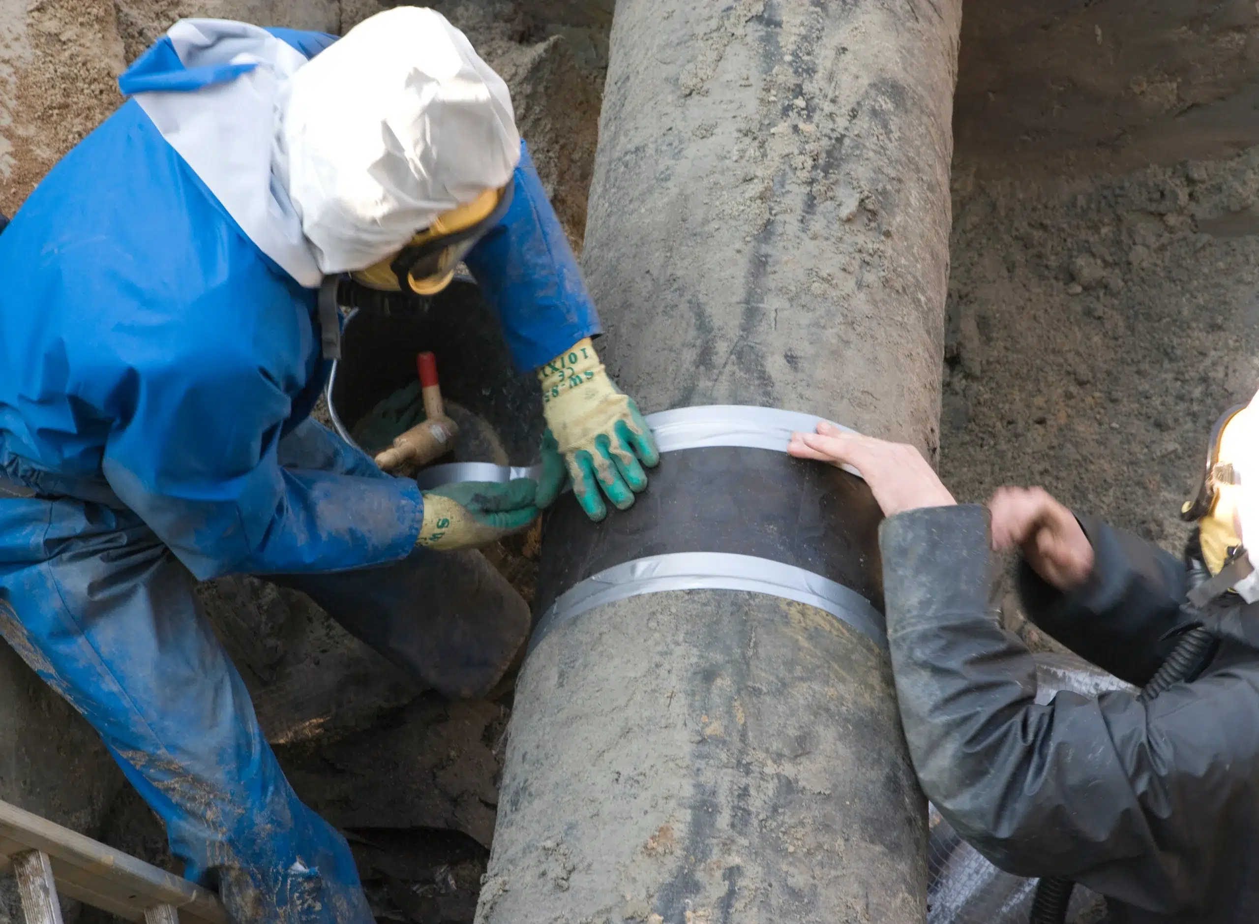 Removal of asbestos. Gaspipe. Pipeline. Protection clothing