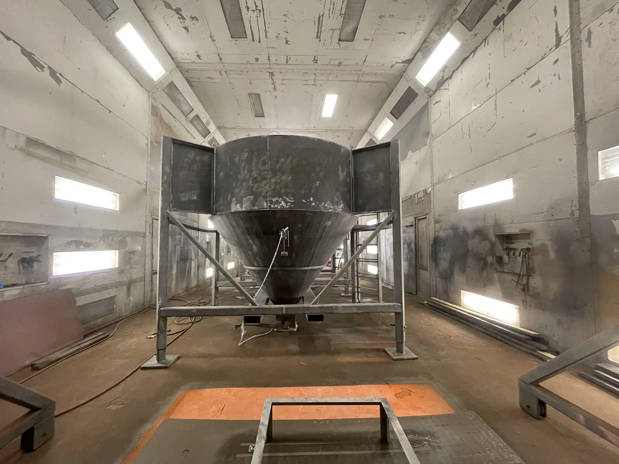 large vessel after being sandblasted ready for paint in paint booth After sandblasting and in our paint booth ready for coating.