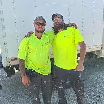 andrew posing with coworker jonathan