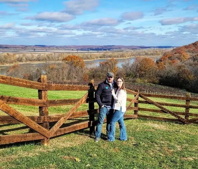 josh posing with wife in countryside