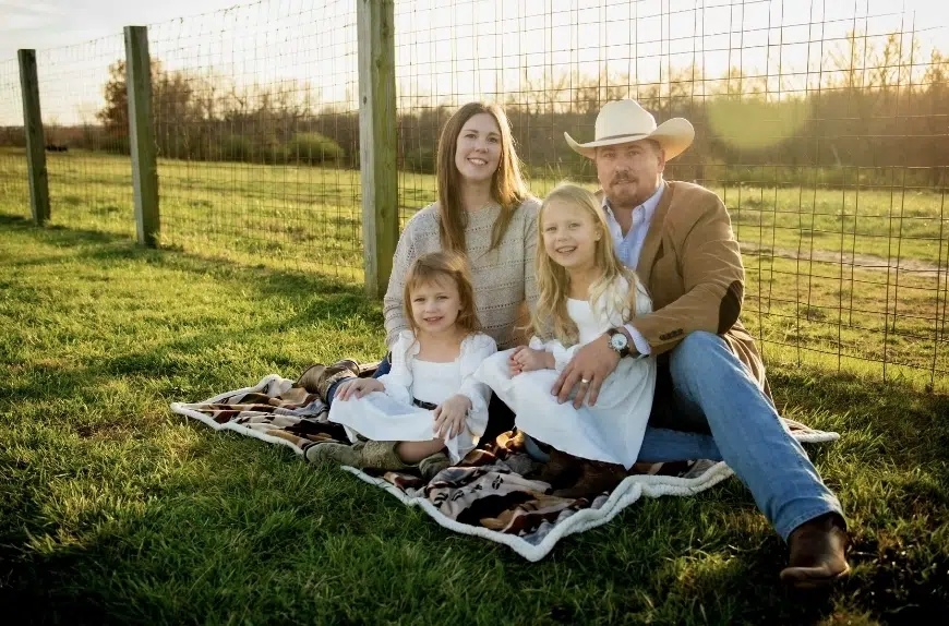 josh with family sitting on blanket in countryside