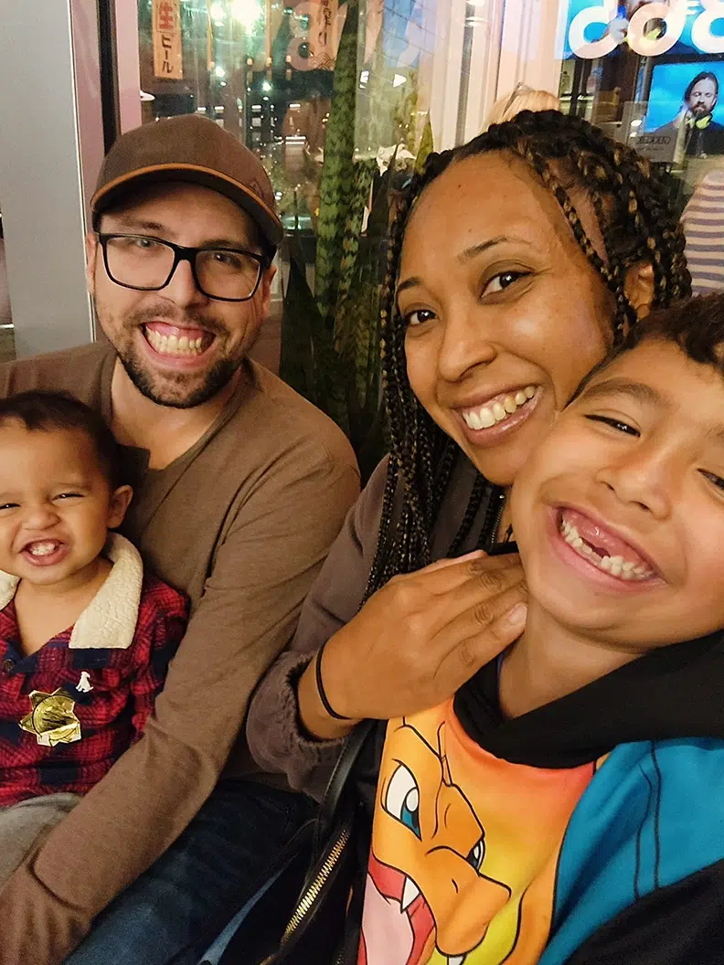 michael with two boys and wife