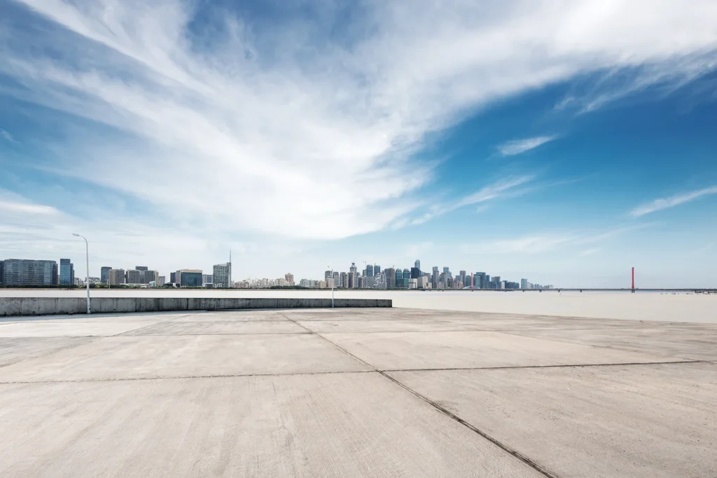 empty concrete floor with modern bridge and buildings concrete cleaning