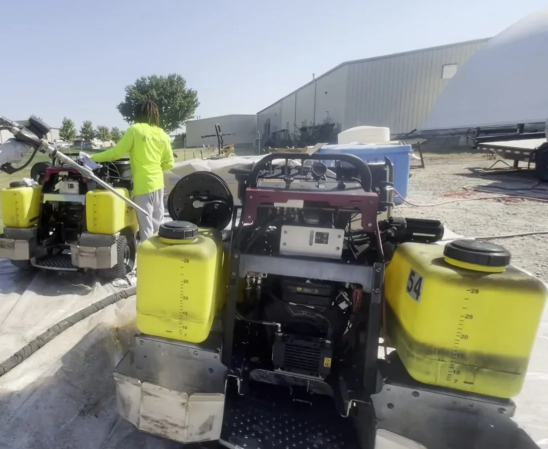 Blast It Clean crew setting up industrial dry ice blasting equipment.